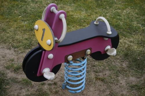 a play equipment with a clock and a baseball glove at House with playground visit Isaberg and High Chaparral in Dannäs