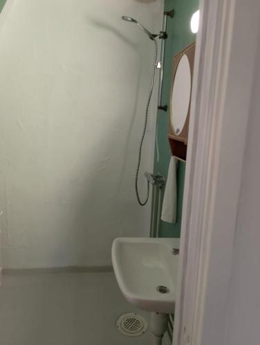 a small bathroom with a sink and a mirror at House with playground visit Isaberg and High Chaparral in Dannäs