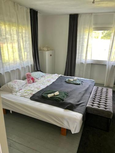 a bedroom with a bed with a teddy bear on it at House with playground visit Isaberg and High Chaparral in Dannäs