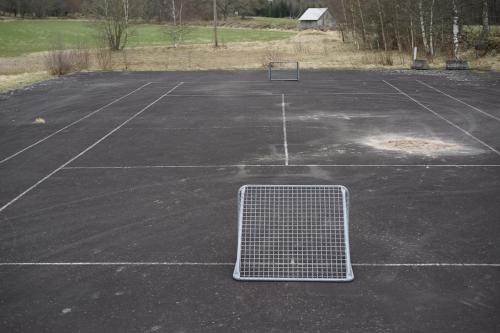 an empty parking lot with a metal grate in it at House with playground visit Isaberg and High Chaparral in Dannäs