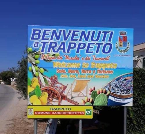 a sign on the side of a road at Sunshine Apartments in Trappeto