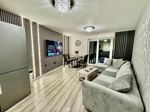 a living room with a couch and a table at City View Apartments in Manchester