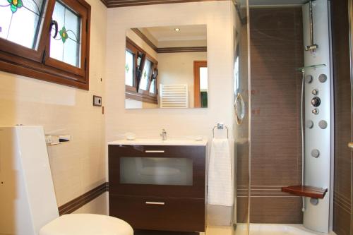 a bathroom with a sink and a shower at Sierra Pulide Apartamentos in Salinas