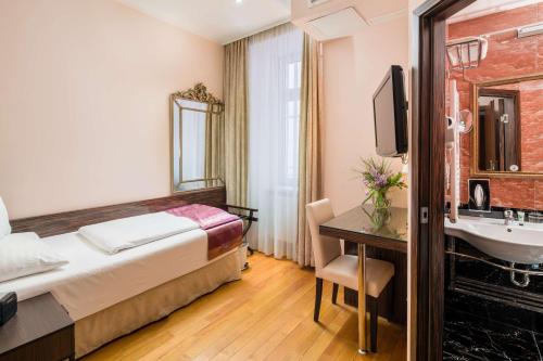 Postel nebo postele na pokoji v ubytování Best Western Plus Hotel Arcadia