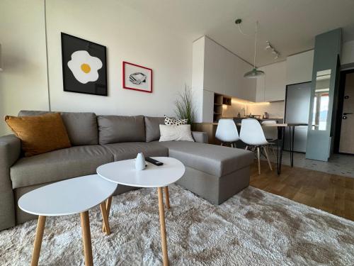 a living room with a couch and a table at Royal Apartments in Skopje