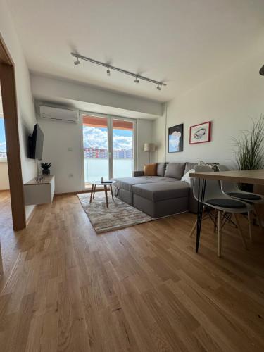 a living room with a couch and a table at Royal Apartments in Skopje
