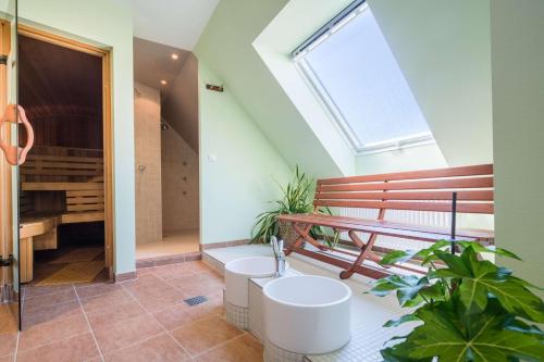 a sanctuary with a bench and a piano in a room at Best Western Hotel Am Straßberger Tor in Plauen