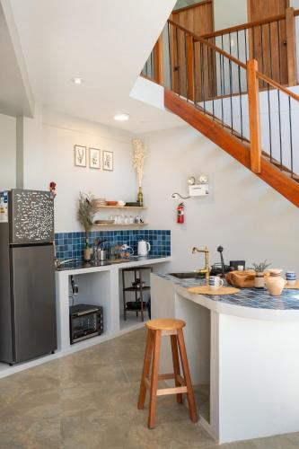 a kitchen with a staircase and a counter top at New Charming Countryside Haven Sacred Valley in Huaran