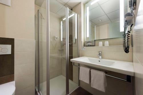 a bathroom with a sink and a shower at Best Western Plus Hotel Willingen in Willingen