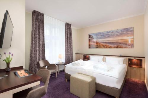 Postel nebo postele na pokoji v ubytování Best Western Plus Ostseehotel Waldschloesschen