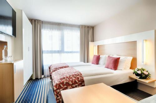Katil atau katil-katil dalam bilik di Best Western Plus Welcome Hotel Frankfurt