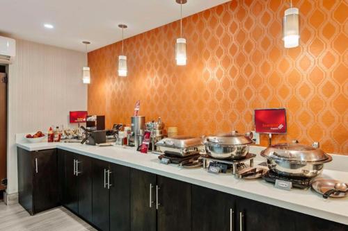 a kitchen with several pots and pans on a counter at Best Western Plus Executive Inn in Toronto