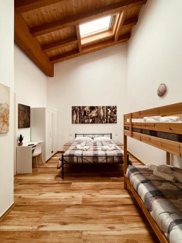 a bedroom with a bed and a desk at Garda Havens in Castelnuovo del Garda