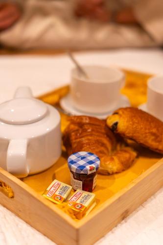 a tray filled with different types of food on a table at Pandora Spa Lille in Lille