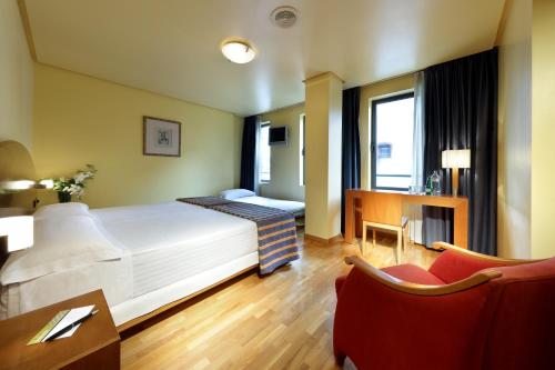 Cama ou camas em um quarto em Exe Hotel El Magistral