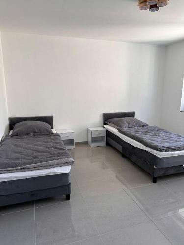 Ένα ή περισσότερα κρεβάτια σε δωμάτιο στο GM Ferienwohnung 3