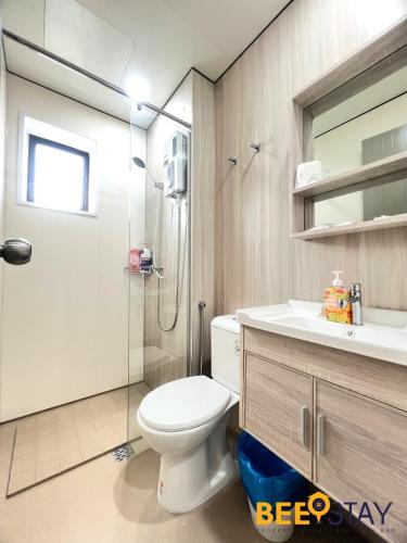 a bathroom with a shower and a toilet and a sink at Youth City Residence Family Suite KLIA AEON Mall Nilai USIM in Nilai