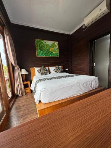 a bedroom with a large bed in a room at The Kanha Palace in Nusa Penida