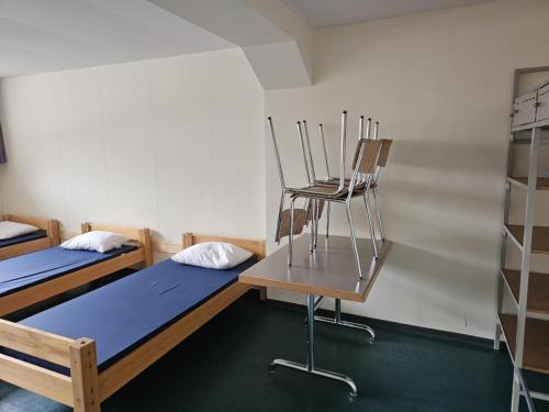 Postel nebo postele na pokoji v ubytování LA Xenia located at Sportcamp Melchtal