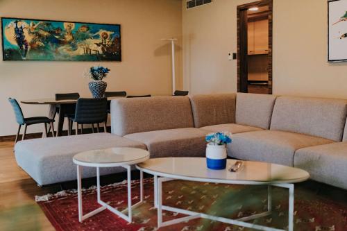 a living room with a couch and tables at DoubleTree by Hilton Trabzon in Trabzon