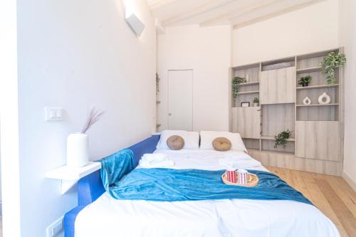 a bedroom with a large bed with two teddy bears on it at Luxury Studio in Porta Romana - Romano 15 in Milan