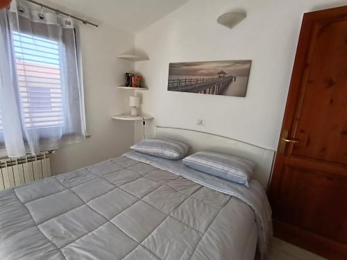 Una cama o camas en una habitación de Anfitrite Tortolì