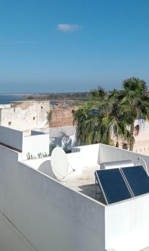 a view of the beach from the roof of a house at Dar DIESUS NOOR in Azemmour