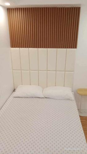 Ένα ή περισσότερα κρεβάτια σε δωμάτιο στο Lumina Home Dumaguete