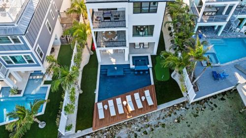 an aerial view of a building with a pool and palm trees at Big Nauti in Bradenton Beach