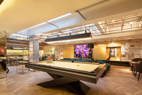 a billiard room with a pool table in it at CITIGO HOUSE Tianhe Guangzhou in Guangzhou