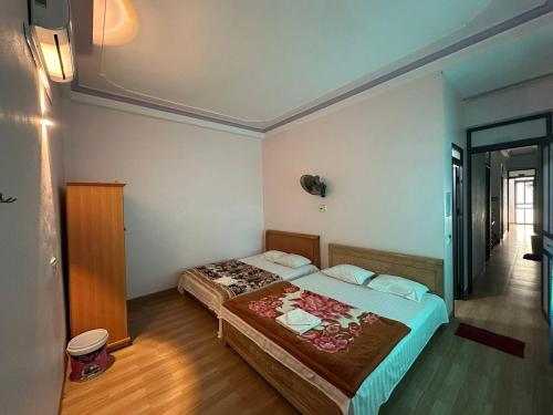 Postel nebo postele na pokoji v ubytování Tiến Minh Hotel cầu Pắc Ta