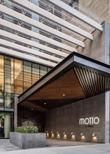 a building with a moto sign in front of it at Motto by Hilton New York City Chelsea in New York