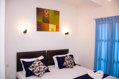 Postel nebo postele na pokoji v ubytování Woodnest Windmill Beach Hotel