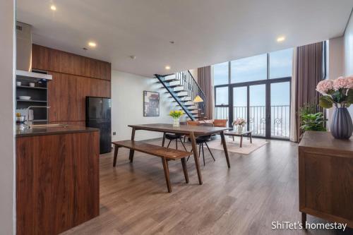 a kitchen and living room with a table and chairs at Pentstudio 1a in Hanoi