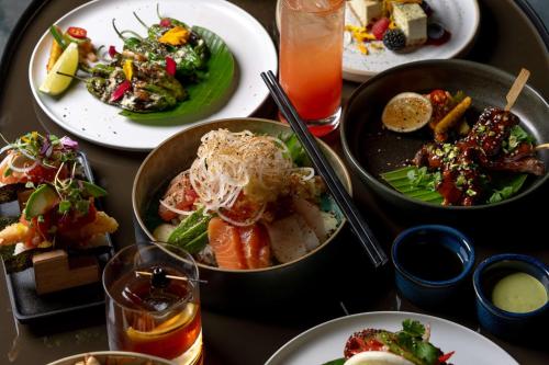 a table with plates of food on a table at Signia by Hilton San Jose in San Jose