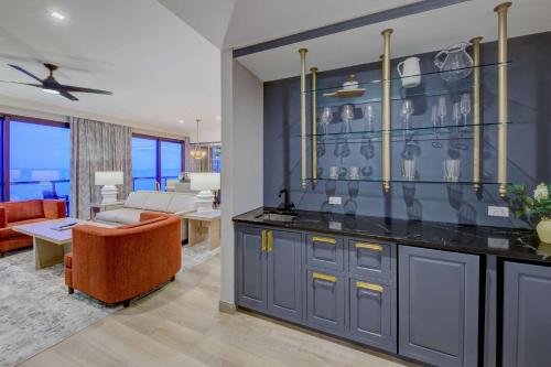 a living room with a kitchen and a dining room at Embassy Suites By Hilton Virginia Beach Oceanfront Resort in Virginia Beach