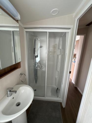 a bathroom with a shower and a sink at Waterfront Kent coast in Rochester