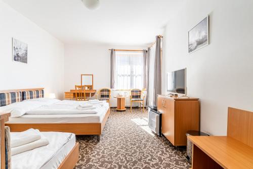 Una cama o camas en una habitación de Garni Hotel Gavurky