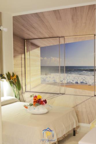 a bedroom with a bed with a view of the ocean at Blu Celeste - by AP Apartment in Baia Verde