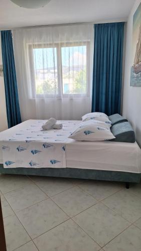 Postel nebo postele na pokoji v ubytování Apartmani I & J Šerić