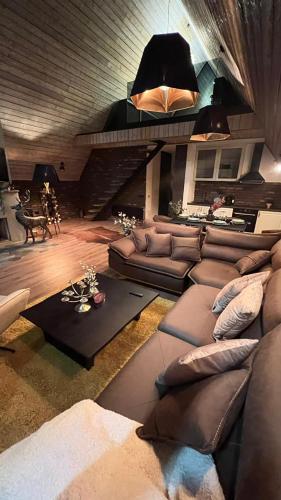 a living room with a couch and a table at One & Only - Peace For You, Zlatibor in Zlatibor