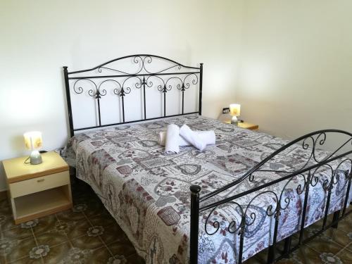 a bedroom with a bed with two pillows on it at Villa Maddalena a Otranto in Otranto