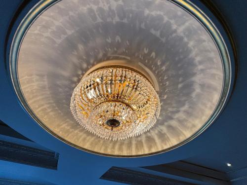 a large chandelier hanging from a ceiling at The Bishop in London