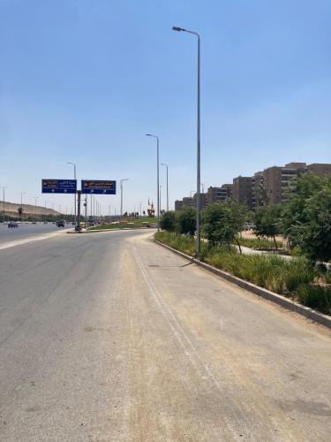 an empty road with a street light on the side at First Row to Pyramids Studio in Kafrat Naşşār