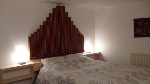Postel nebo postele na pokoji v ubytování Le Gîte du Facteur d 'Orgues