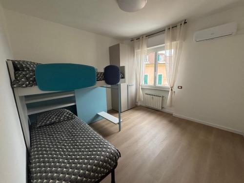 a bedroom with a bunk bed and a couch at Psalm 23 in Savona