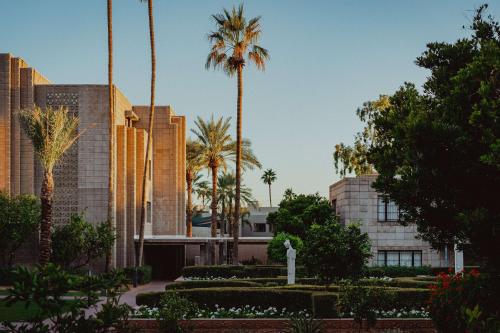 a building with palm trees in front of it at Arizona Biltmore, LXR Hotels & Resorts in Phoenix