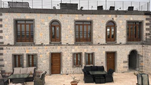 a brick building with a bunch of windows at Gala Cave Cappadocia in Goreme