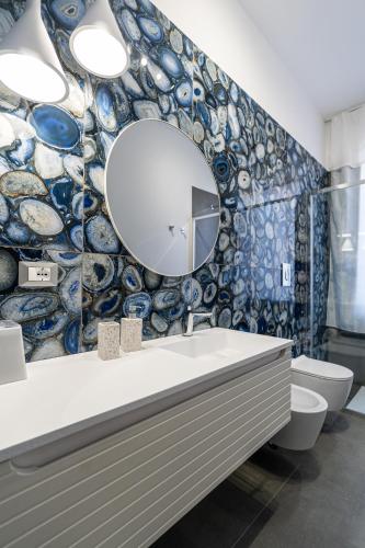 a bathroom with a sink and a mirror on the wall at La Villa di Nonna Pina in Balestrate