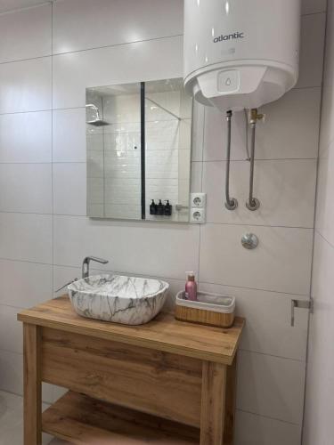 a bathroom with a sink and a mirror at Old Town Heritage in Gradačac